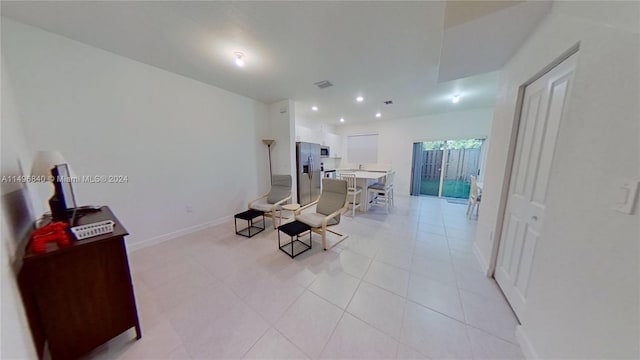 interior space featuring light tile floors