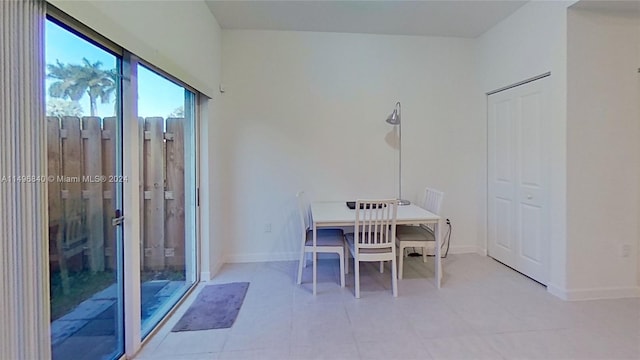 unfurnished dining area with light tile flooring