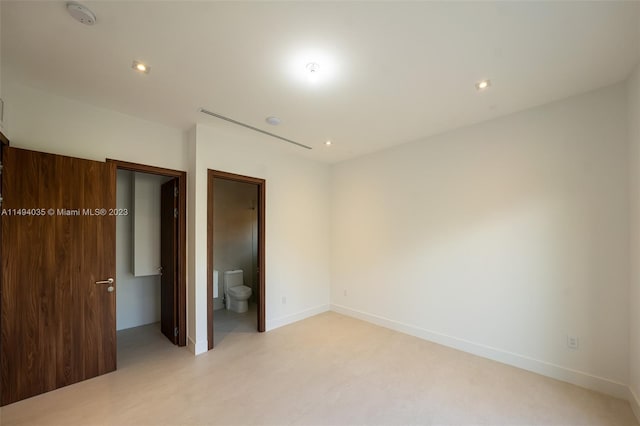 unfurnished bedroom featuring recessed lighting, ensuite bath, and baseboards