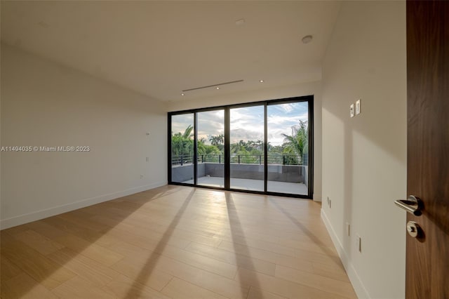 unfurnished room featuring baseboards