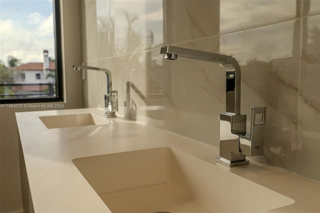 details featuring a shower stall and vanity