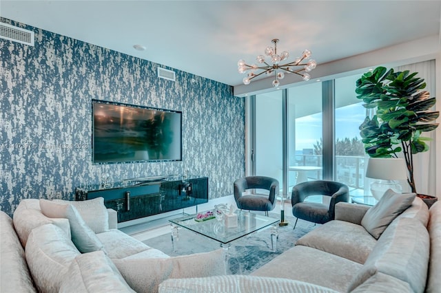 living room featuring a notable chandelier