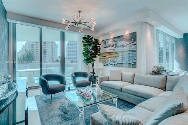 living room with tile patterned flooring and an inviting chandelier