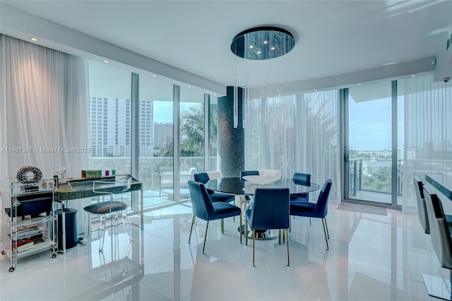 dining room with expansive windows, a healthy amount of sunlight, and light tile patterned flooring