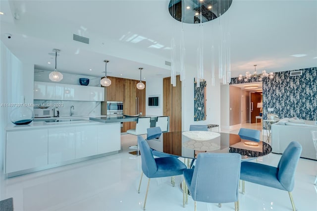 dining room with a notable chandelier