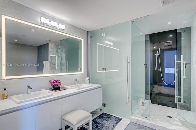 bathroom with vanity, tile patterned flooring, and walk in shower