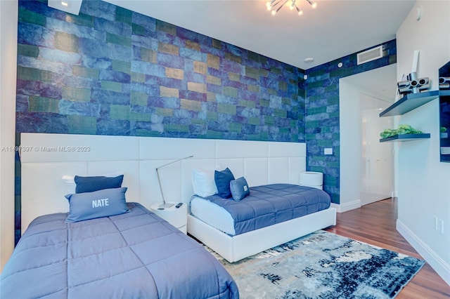 bedroom featuring hardwood / wood-style flooring