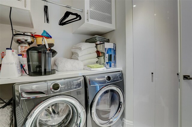 washroom with washer and dryer