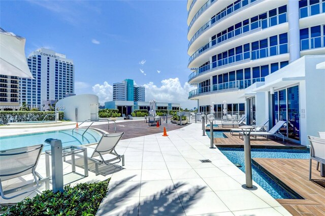 view of swimming pool with a patio