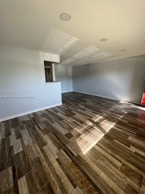 spare room featuring dark hardwood / wood-style floors