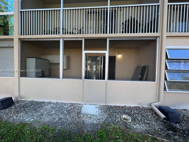 view of home's exterior with a balcony