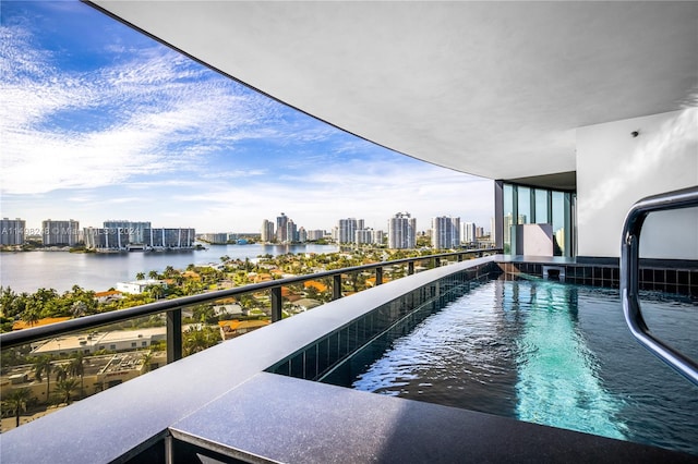 balcony featuring a water view