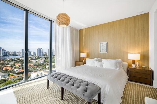 bedroom with floor to ceiling windows