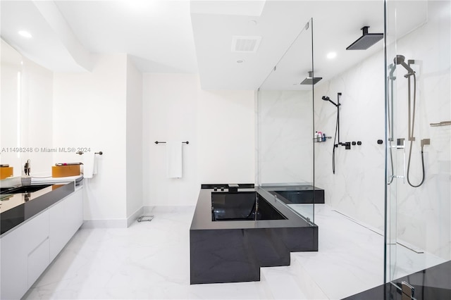 bathroom featuring vanity and shower with separate bathtub