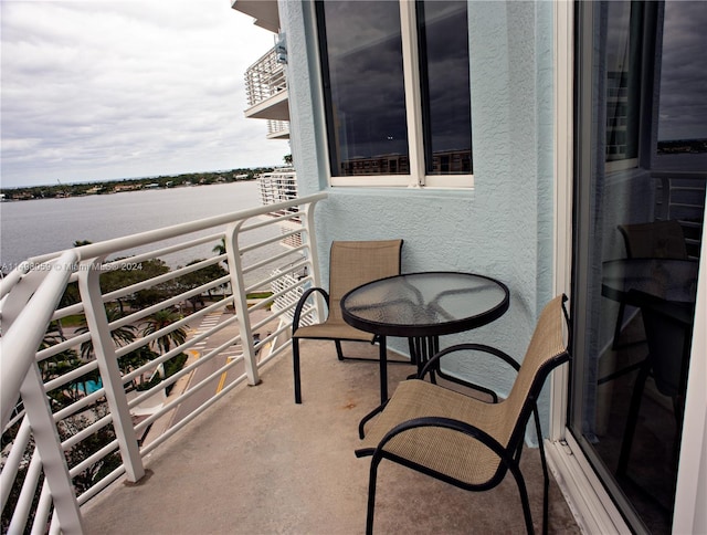 balcony featuring a water view
