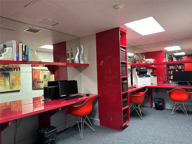 office area with built in study area and carpet flooring