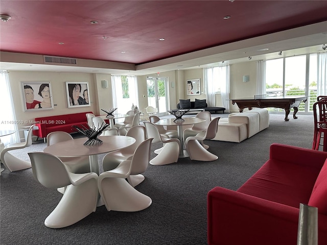 carpeted dining room with visible vents and pool table