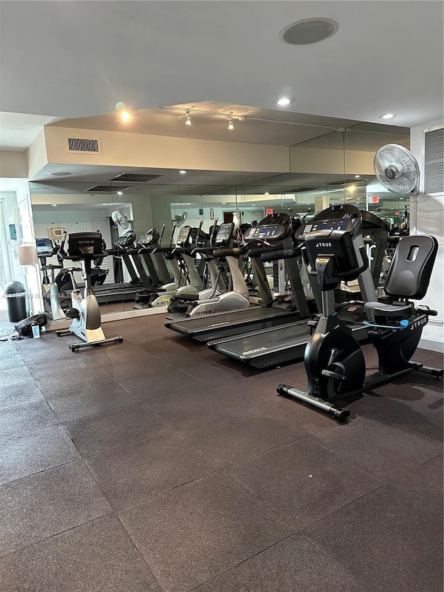 workout area featuring visible vents and recessed lighting