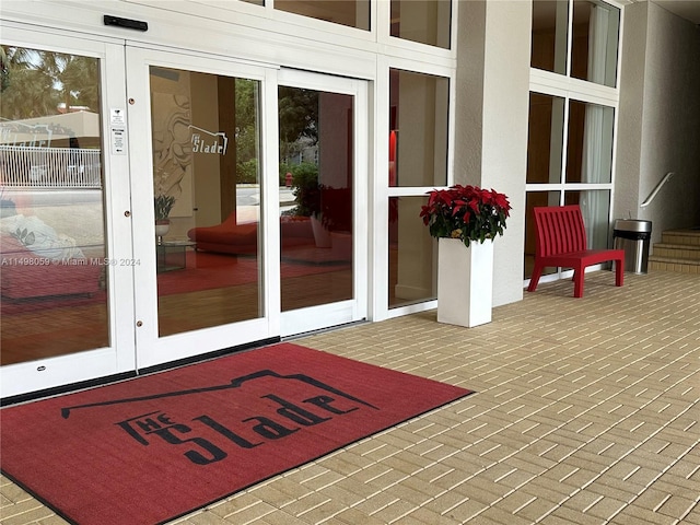 doorway to property with french doors and stucco siding