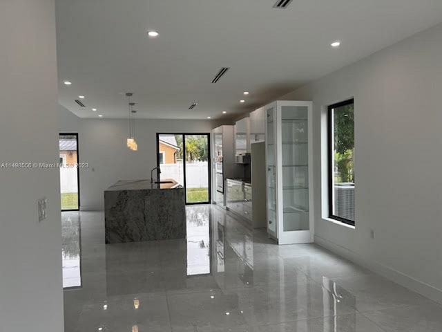 kitchen with pendant lighting and white cabinets