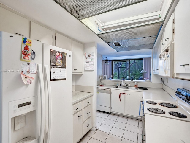 kitchen featuring light tile patterned floors, sink, white appliances, and white cabinets