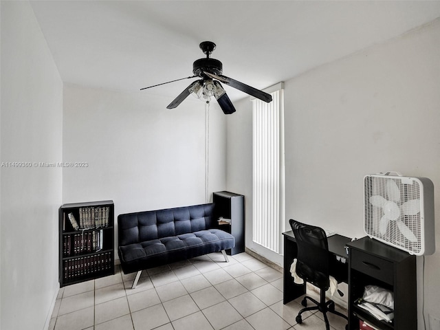 tiled home office with ceiling fan and a healthy amount of sunlight