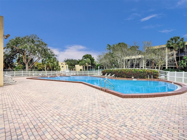 view of swimming pool with a patio area