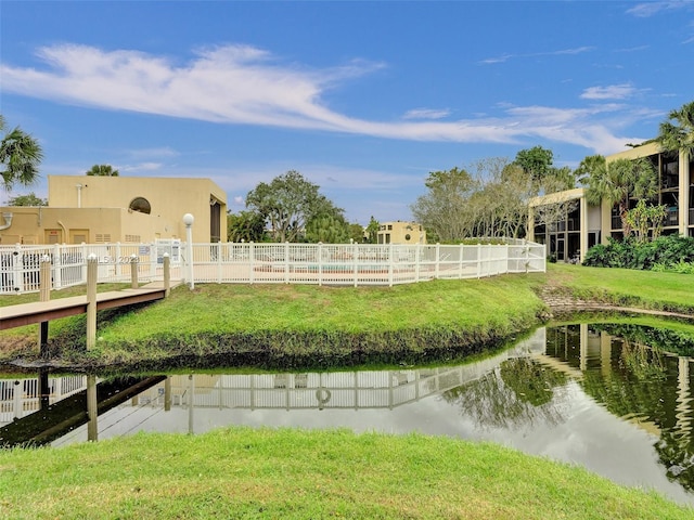 exterior space featuring a water view and a yard