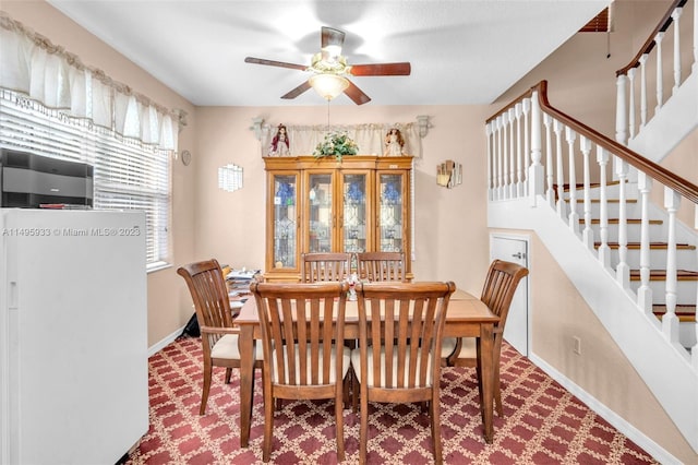 dining room featuring ceiling fan