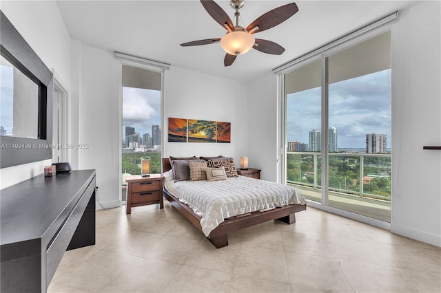 tiled bedroom with ceiling fan and access to exterior