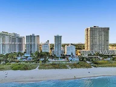 exterior space with a beach view and a water view