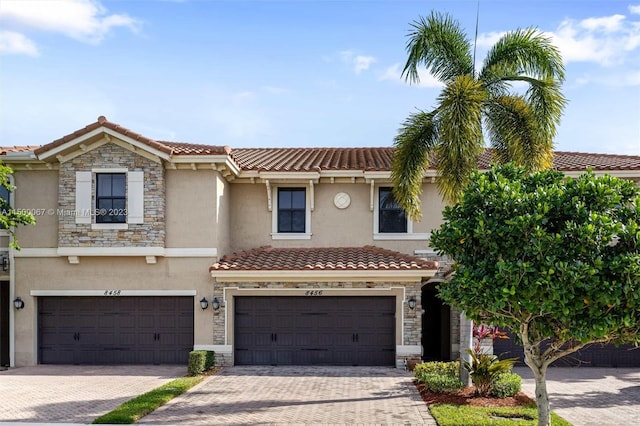 mediterranean / spanish-style house featuring a garage