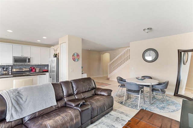 living room featuring light tile patterned flooring