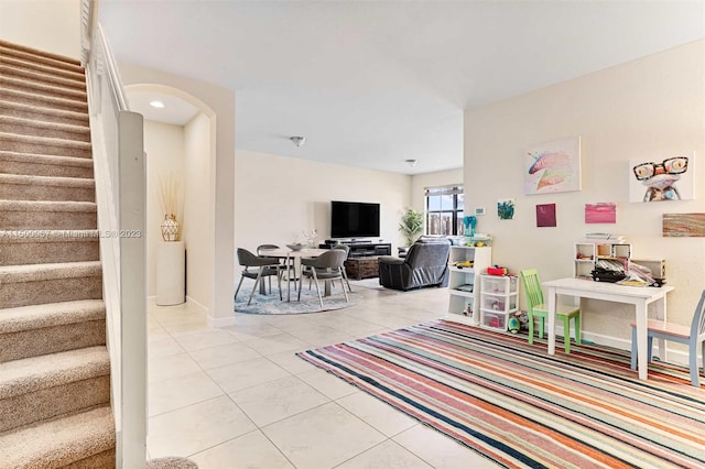 living room with light tile patterned floors