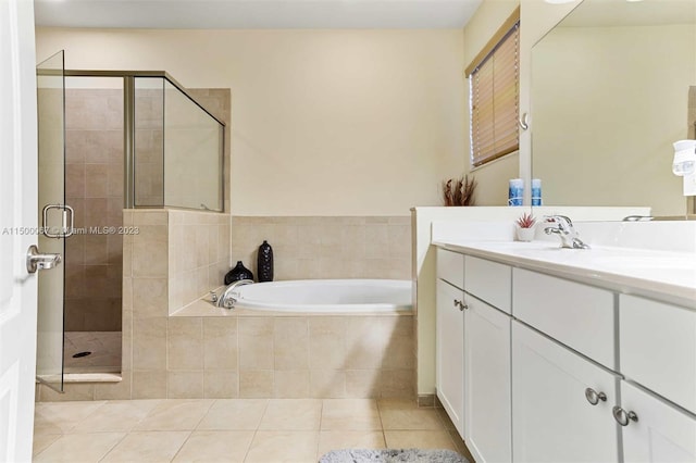 bathroom featuring tile patterned flooring, vanity, and plus walk in shower