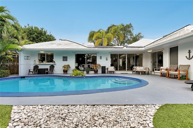 view of swimming pool featuring a patio