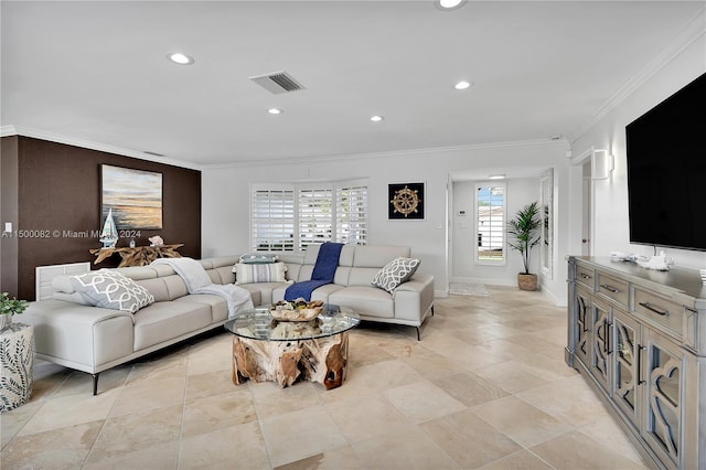 living room with plenty of natural light and ornamental molding