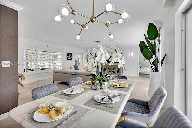 dining space with a chandelier, light tile patterned floors, and ornamental molding