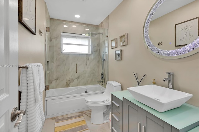 full bathroom featuring vanity, toilet, and enclosed tub / shower combo