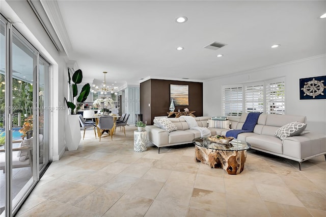 living room featuring light tile patterned floors, crown molding, and a chandelier