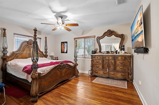 bedroom with ceiling fan and hardwood / wood-style floors