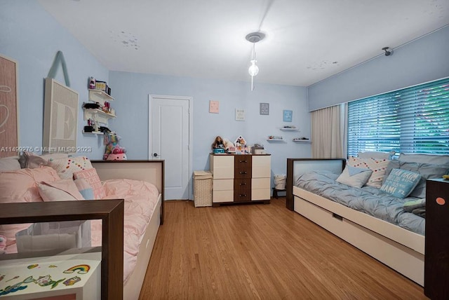 bedroom with wood-type flooring