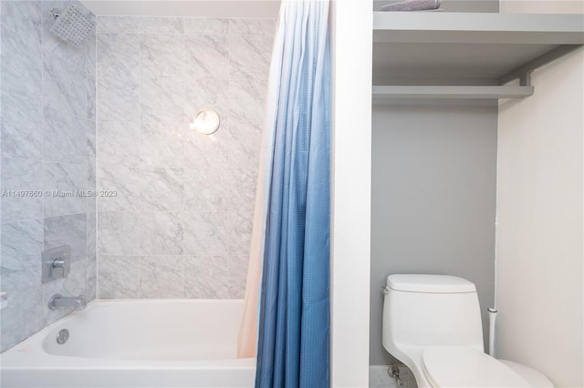 bathroom featuring shower / bath combo with shower curtain and toilet