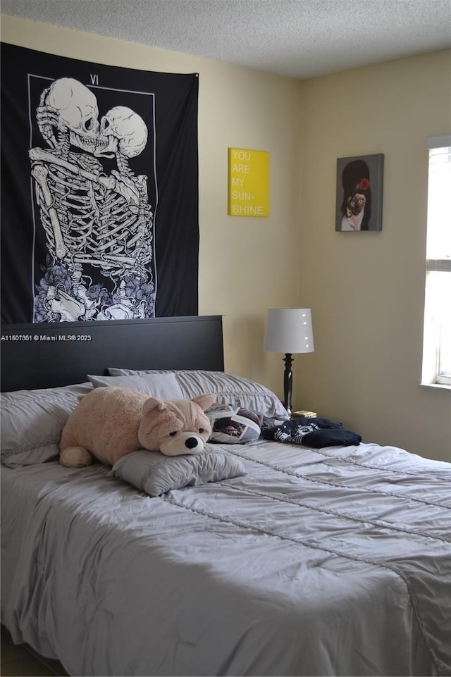 bedroom featuring a textured ceiling