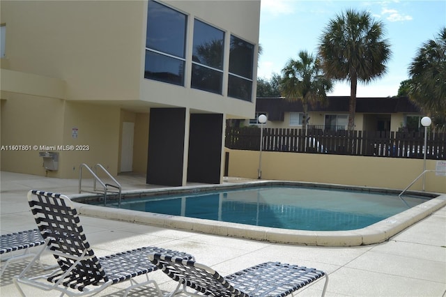 view of swimming pool featuring a patio