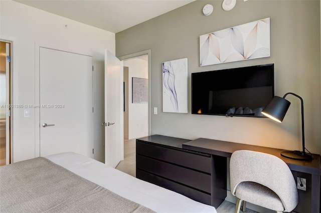 bedroom with light hardwood / wood-style floors