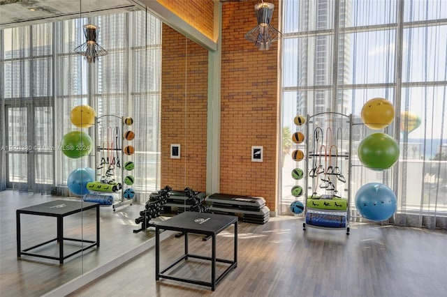 4010 S Ocean Dr Unit R2106, Hollywood, FL 33019 - gym featuring floor to ceiling windows, a high ceiling, a healthy amount of sunlight, and brick wall