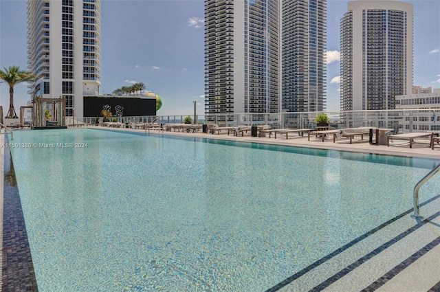 4010 S Ocean Dr Unit R2106, Hollywood, FL 33019 - community pool featuring a patio and a view of city