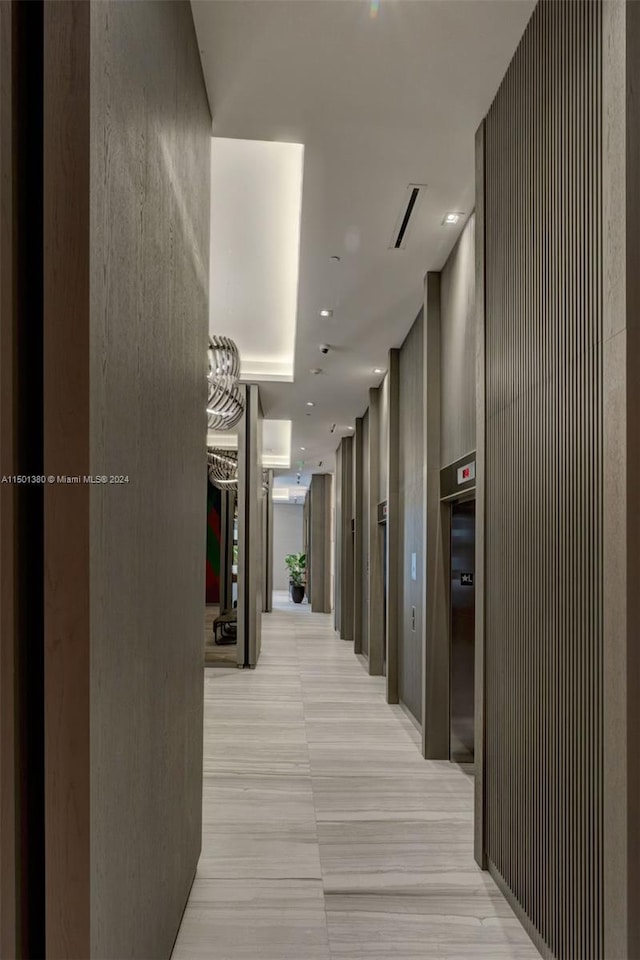 hallway featuring elevator