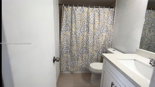 bathroom with vanity, a shower with curtain, and toilet